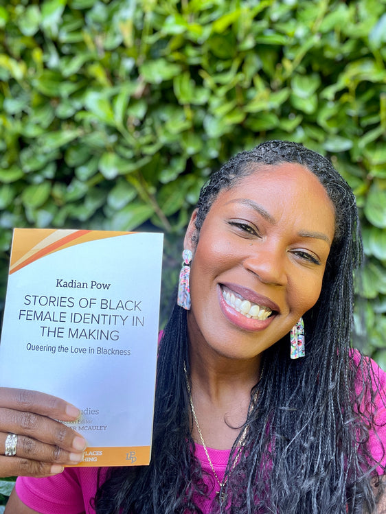 Dr. Kadian Pow with her new book